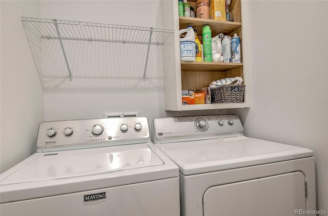 clothes washing area with laundry area and separate washer and dryer