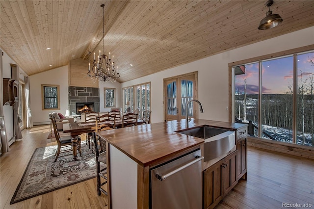 kitchen with wooden ceiling, butcher block counters, a sink, light wood-type flooring, and dishwasher