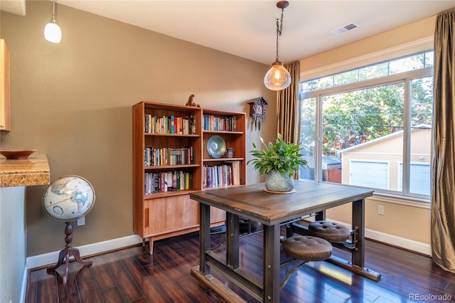 dining space with visible vents, baseboards, dark wood-type flooring, and a healthy amount of sunlight