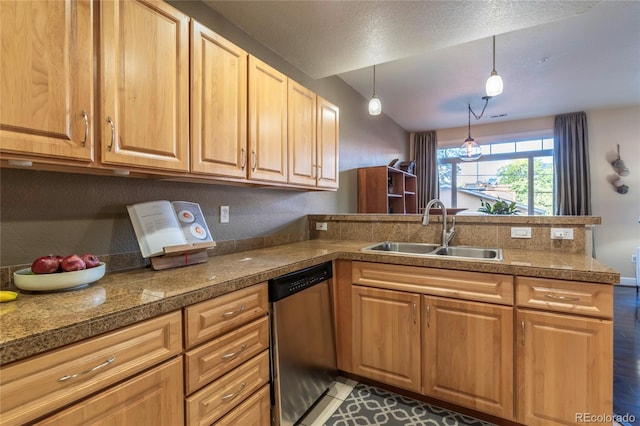 kitchen with a sink, stainless steel dishwasher, tile countertops, a peninsula, and hanging light fixtures