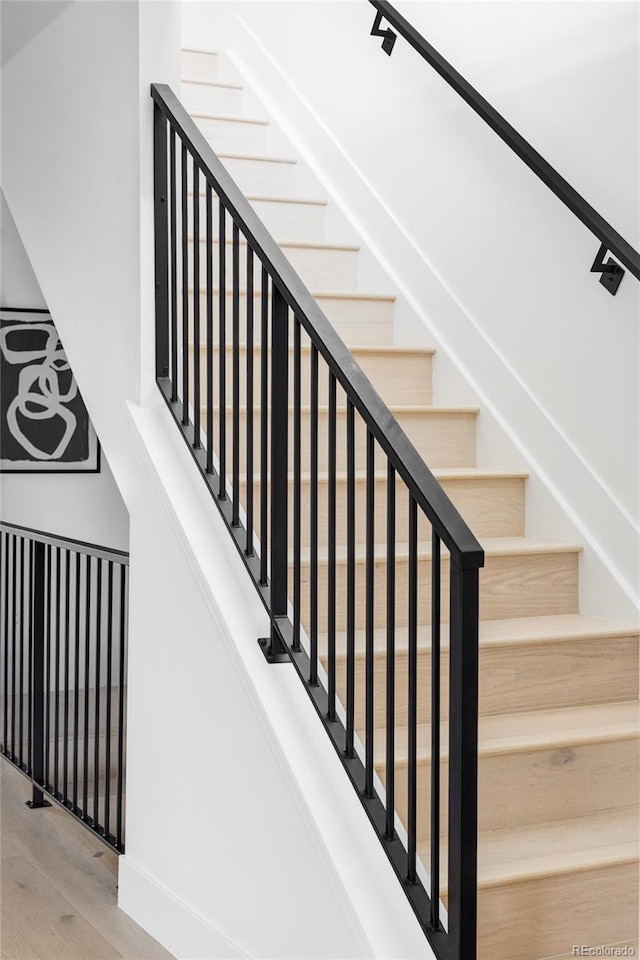 425 S Pearl St, Denver, CO 80209 - staircase with wood finished floors and baseboards