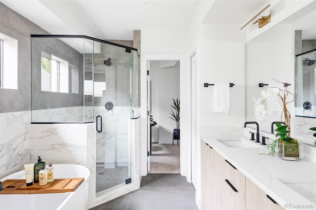 425 S Pearl St, Denver, CO 80209 - bathroom with a freestanding tub, a shower stall, double vanity, and tile patterned flooring