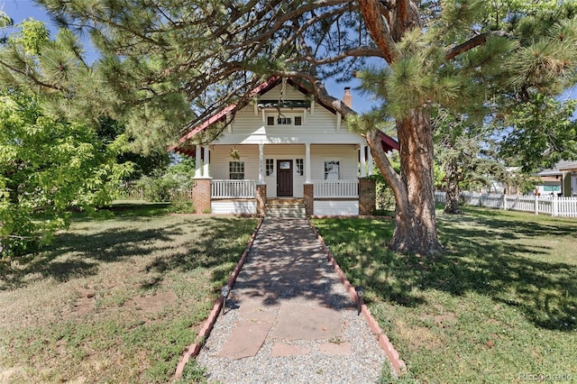 7801 Valley View St, Louviers, CO 80131 - view of front of property with covered porch and a chimney