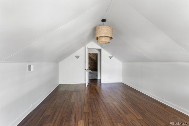7801 Valley View St, Louviers, CO 80131 - additional living space featuring lofted ceiling and wood finished floors