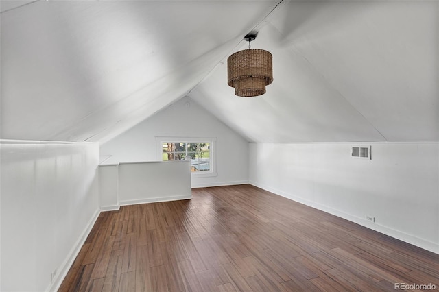 7801 Valley View St, Louviers, CO 80131 - additional living space featuring vaulted ceiling and wood finished floors
