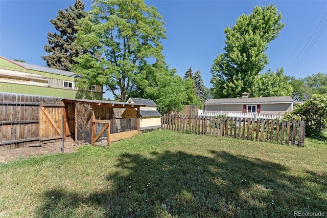 7801 Valley View St, Louviers, CO 80131 - fenced backyard with exterior structure and an outdoor structure