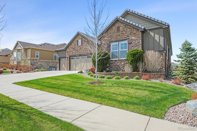 7797 S Valleyhead Way, Aurora, CO 80016 - view of front of home featuring stone siding, board and batten siding, a front lawn, and concrete driveway