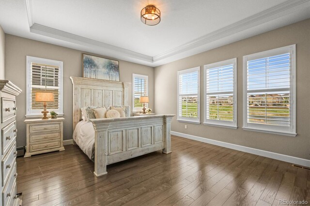 7797 S Valleyhead Way, Aurora, CO 80016 - bedroom featuring a raised ceiling, baseboards, dark wood-style floors, and visible vents