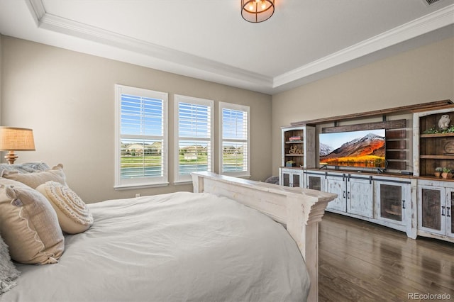 7797 S Valleyhead Way, Aurora, CO 80016 - bedroom featuring a tray ceiling, crown molding, access to exterior, and dark wood-style floors