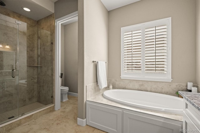 7797 S Valleyhead Way, Aurora, CO 80016 - bathroom with toilet, a garden tub, vanity, and a stall shower