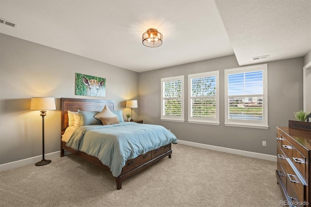 7797 S Valleyhead Way, Aurora, CO 80016 - bedroom featuring baseboards, light carpet, and visible vents