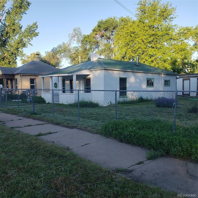 511 N Petroleum Ave, Florence, CO 81226 - view of front of property with stucco siding and a chimney