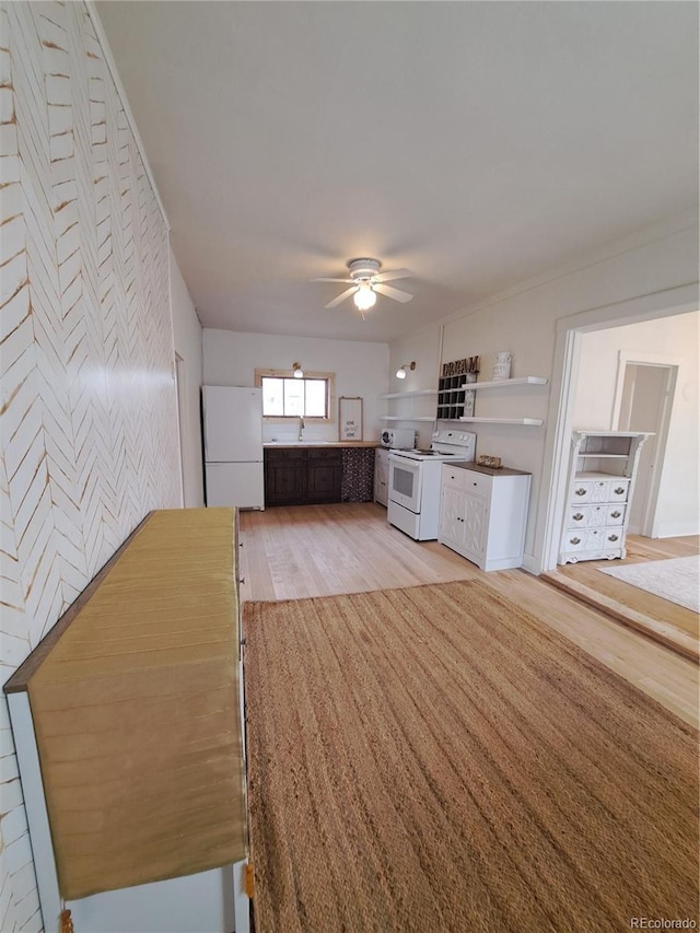 511 N Petroleum Ave, Florence, CO 81226 - kitchen with white appliances, light wood-type flooring, a ceiling fan, a sink, and open shelves