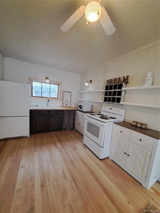 511 N Petroleum Ave, Florence, CO 81226 - kitchen with white appliances, open shelves, a sink, light wood-style flooring, and ceiling fan