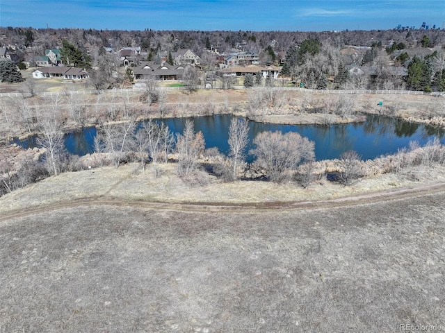 birds eye view of property with a residential view and a water view