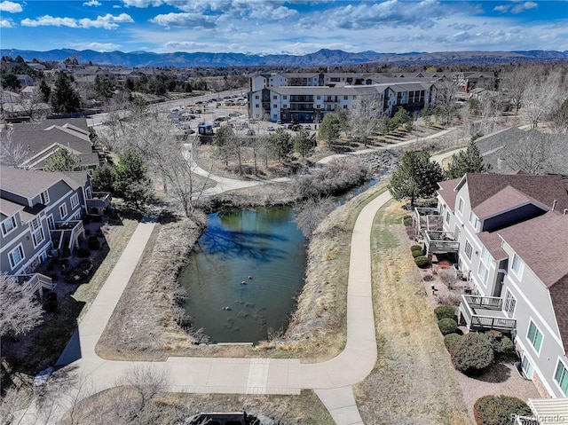 birds eye view of property with a residential view and a water and mountain view