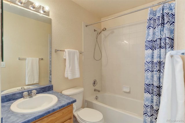 bathroom featuring toilet, shower / bath combo, and vanity