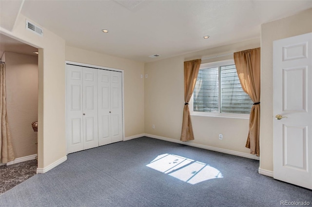 unfurnished bedroom with a closet, baseboards, recessed lighting, carpet flooring, and visible vents