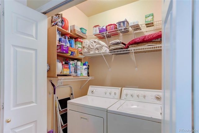 laundry room with separate washer and dryer and laundry area