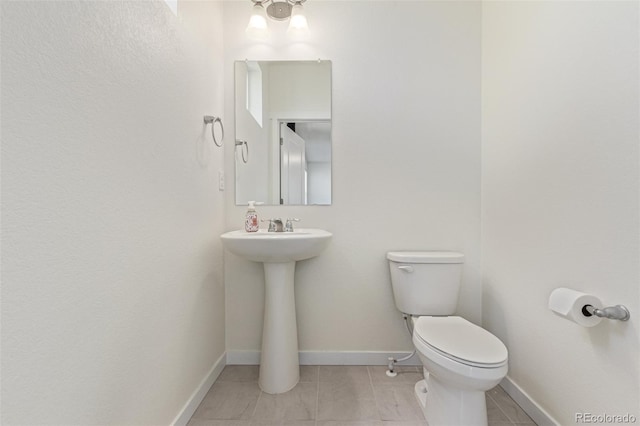 21821 E 7th Ave, Aurora, CO 80018 - half bathroom with toilet and tile patterned flooring