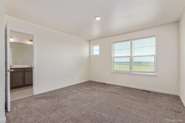 21821 E 7th Ave, Aurora, CO 80018 - unfurnished room featuring light colored carpet and baseboards