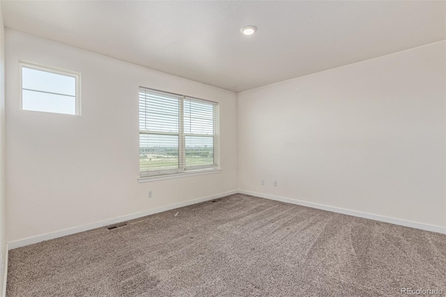 21821 E 7th Ave, Aurora, CO 80018 - unfurnished room with healthy amount of natural light and carpet flooring