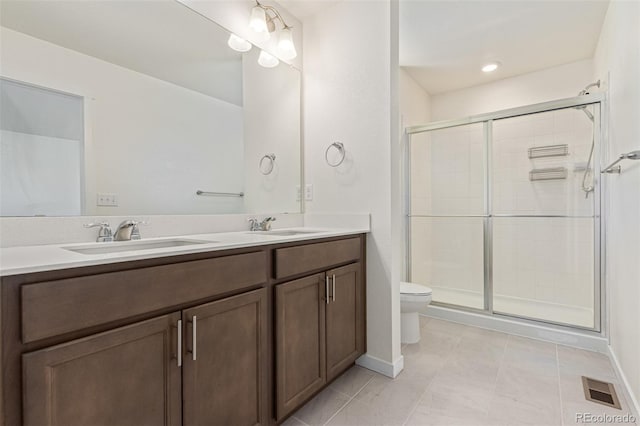 21821 E 7th Ave, Aurora, CO 80018 - full bath featuring double vanity, a shower stall, and tile patterned flooring