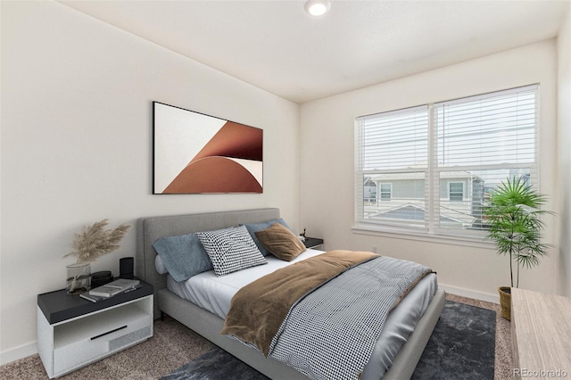 21821 E 7th Ave, Aurora, CO 80018 - carpeted bedroom featuring baseboards