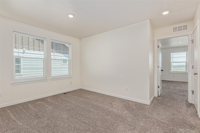 21821 E 7th Ave, Aurora, CO 80018 - empty room with light colored carpet and recessed lighting