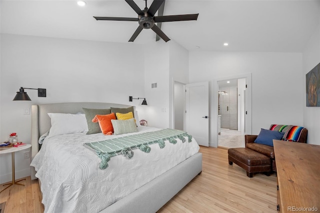 bedroom featuring ceiling fan, wood finished floors, high vaulted ceiling, ensuite bathroom, and recessed lighting
