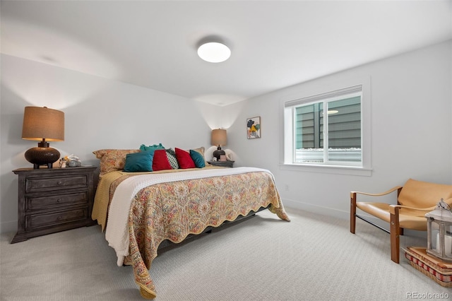 bedroom with baseboards and carpet flooring