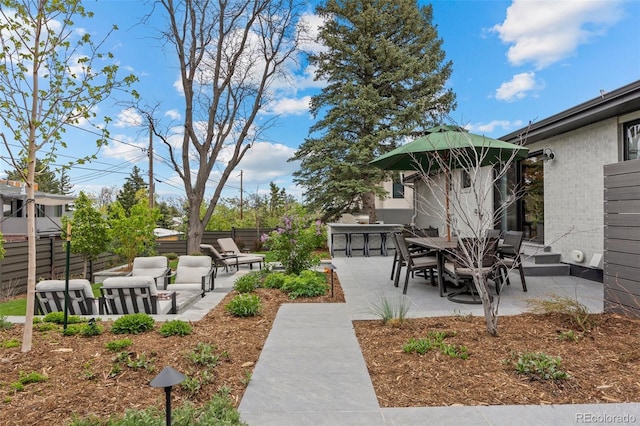 view of yard featuring a patio and fence