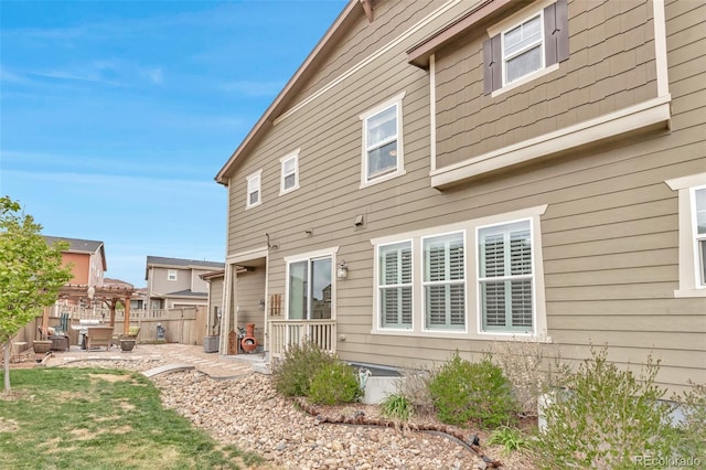 3778 Happyheart Way, Castle Rock, CO 80109 - rear view of property featuring a patio