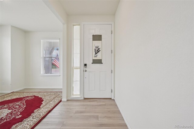 12854 Clearview St, Firestone, CO 80504 - entryway featuring light wood-style flooring and baseboards