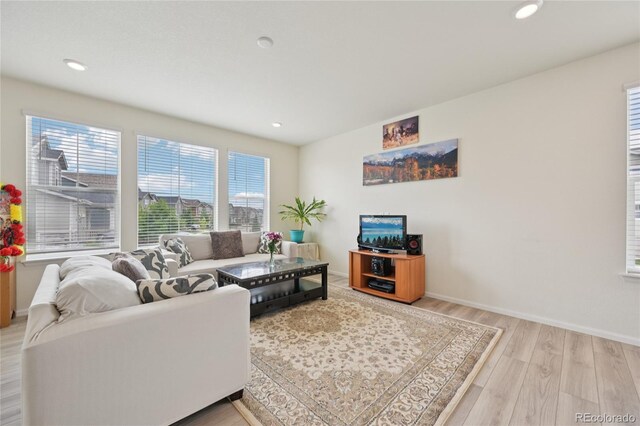 12854 Clearview St, Firestone, CO 80504 - living room with wood finished floors and recessed lighting