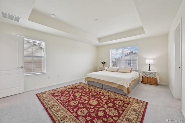 12854 Clearview St, Firestone, CO 80504 - carpeted bedroom with a tray ceiling and baseboards