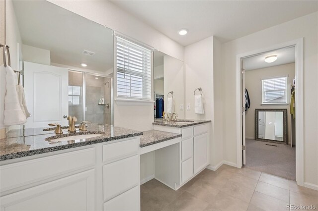 12854 Clearview St, Firestone, CO 80504 - full bath featuring a stall shower, vanity, and tile patterned flooring