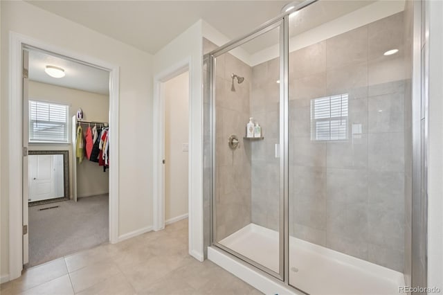 12854 Clearview St, Firestone, CO 80504 - full bathroom with a shower stall, a walk in closet, and tile patterned floors