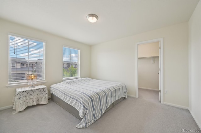 12854 Clearview St, Firestone, CO 80504 - carpeted bedroom featuring baseboards and a spacious closet