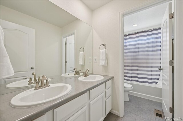 12854 Clearview St, Firestone, CO 80504 - bathroom with double vanity, tile patterned floors, and shower / bathtub combination with curtain