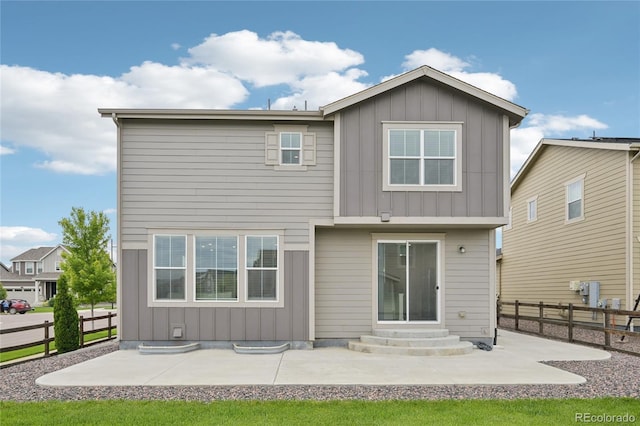 12854 Clearview St, Firestone, CO 80504 - back of house with board and batten siding, a patio, and entry steps