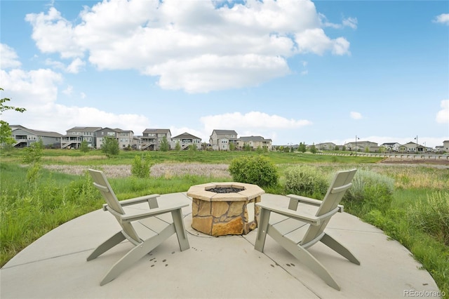 12854 Clearview St, Firestone, CO 80504 - view of patio / terrace with an outdoor fire pit and a residential view
