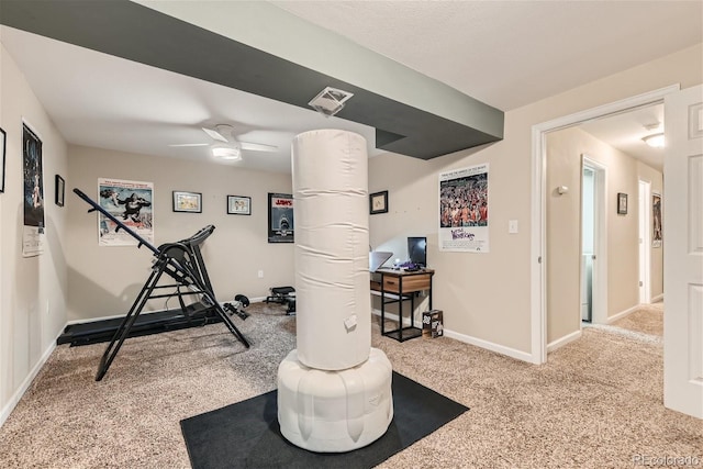 exercise area with ceiling fan and carpet