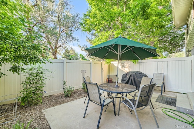 view of patio featuring a grill