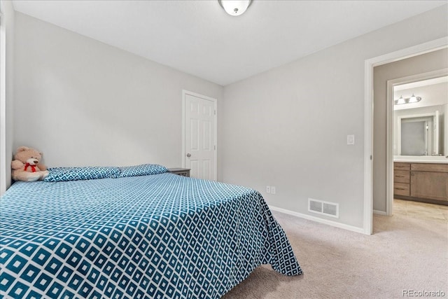 bedroom with visible vents, carpet flooring, and baseboards