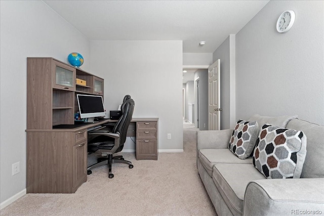 office area featuring light colored carpet and baseboards