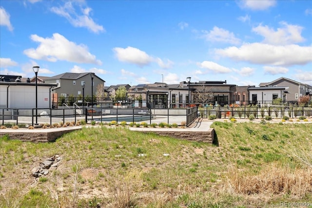 view of yard with fence and a residential view