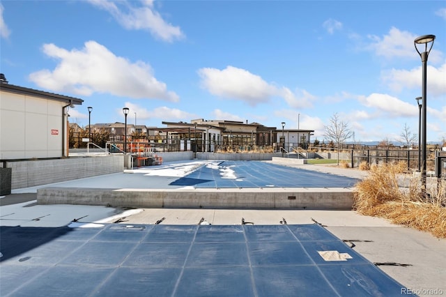 view of pool with a residential view
