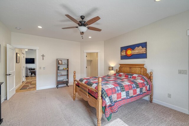 carpeted bedroom featuring baseboards, ceiling fan, and recessed lighting