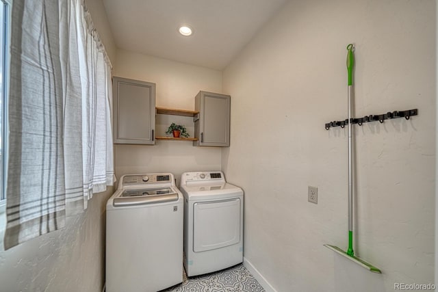 clothes washing area with cabinet space, baseboards, separate washer and dryer, and recessed lighting